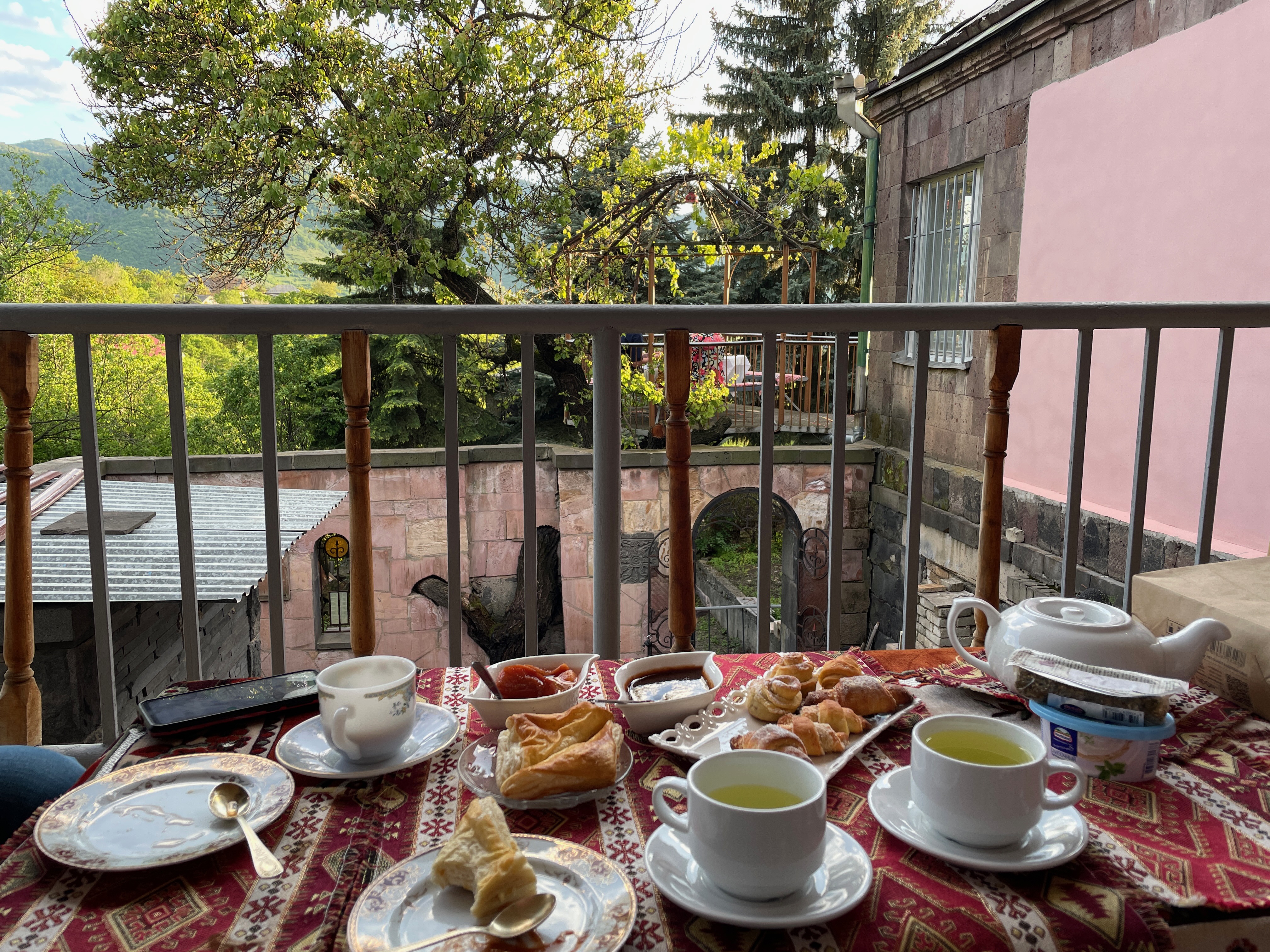 Breakfast and tea in front of a medieval style stone wall