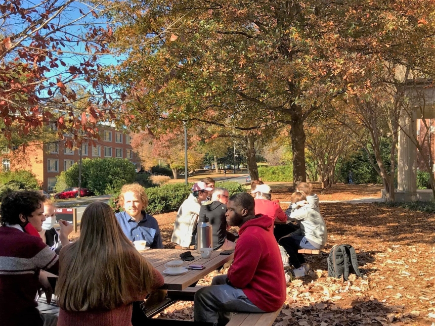 ​ Students and faculty mingle on campus in front of Joe Brown Hall at the University of Georgia's Department of Germanic & Slavic Studies